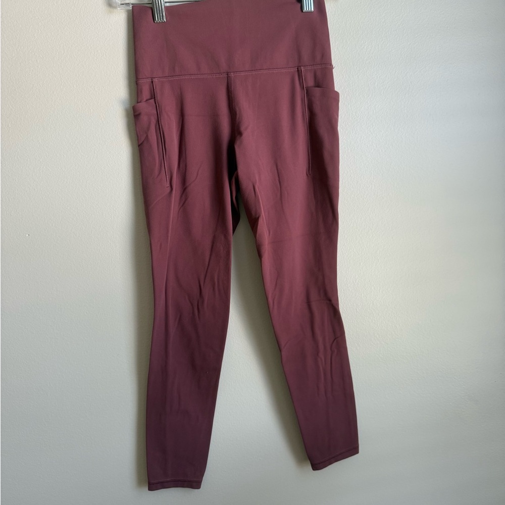 Athleta Dusty Rose salutation stash pocket  7/8 Leggings